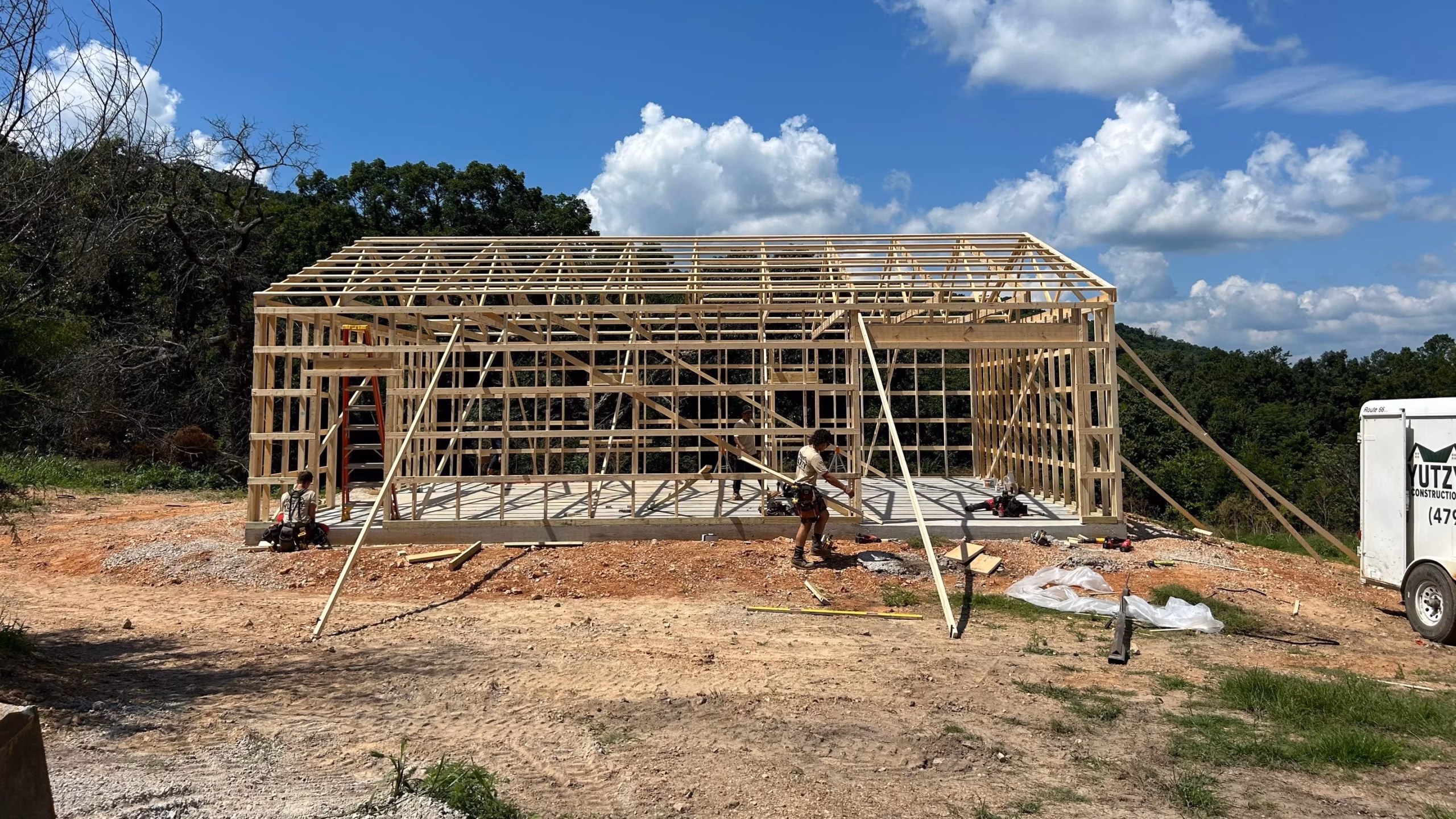 The yutzy construction crew finishing up the wall framing on a metal building project in northwest arkansas