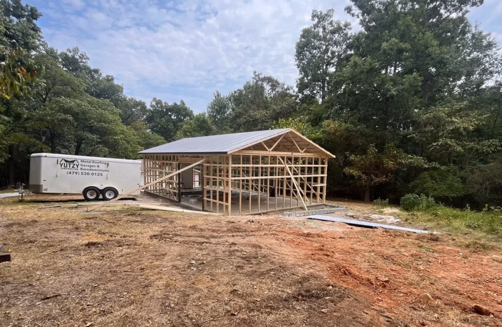 A metal stud framed building under construction in the ozarks